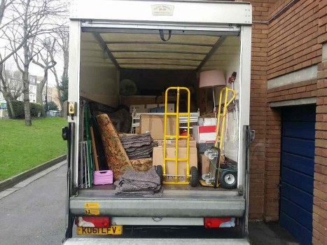 Movers carefully packing furniture for a move