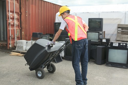 Business team assessing skip sizes for waste management